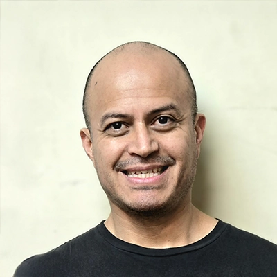 Humberto Juarez smiling in a black shirt.